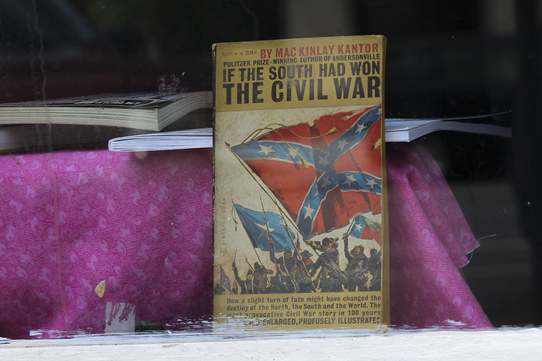 The book “If the South Had Won the Civil War” stands in the window of a bookstore on Cotton Avenue. In the 1800s, cotton was the backbone of Macon’s economy, and the city served as an arsenal for the Confederacy. Some say much of Macon’s black and white population remains divided today. (Phillip Jackson/News21)