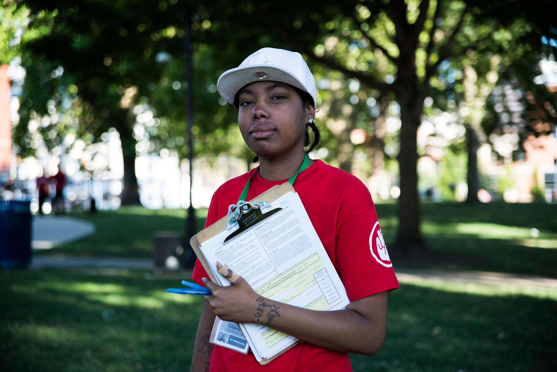 Brittany Middlebrooks, 26, is part of the grassroots Amos Project in Cincinnati. The group works to combat recent name removals from voter registration lists. Middlebrooks was diagnosed with lupus, which makes it hard for her to walk, but her passion and dedication for her work pushes her to get out and help her fellow voters in Washington Park. (Roman Knertser/News21)
