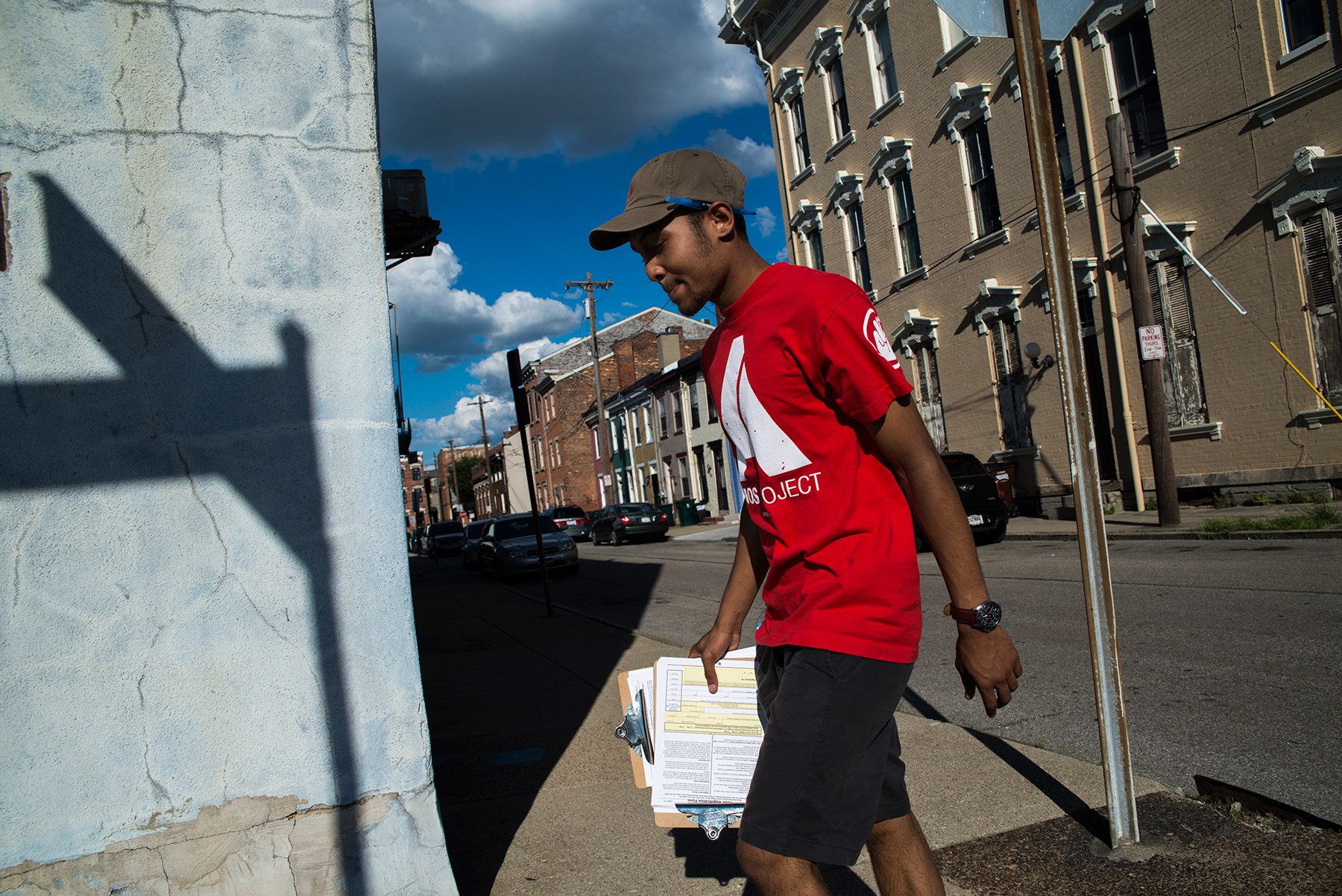 Dallas Stokes, a volunteer for the AMOS Project, a nonprofit social justice organization in Cincinnati, registers people to vote. Ohio is one of  several states where politicians have claimed voter fraud is a problem. (Roman Knertser/News21)
