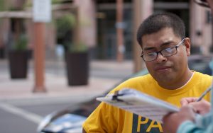 Jose Barboza, a volunteer for Promise Arizona, works to get people registered to vote. (Photo by Courtney Columbus/News21)