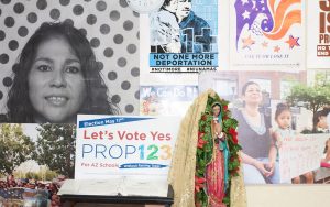 A wall at the Phoenix office of Promise Arizona depicts scenes of the importance of voting. (Photo by Courtney Columbus/News21)